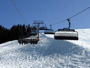 Aualmbahn - 8er Hochgeschwindigkeits-Sesselbahn (kuppelbar) mit Abdeckhauben und Sitzheizung