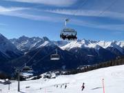 Prui-Clünas - 6er Hochgeschwindigkeits-Sesselbahn (kuppelbar) mit Abdeckhauben